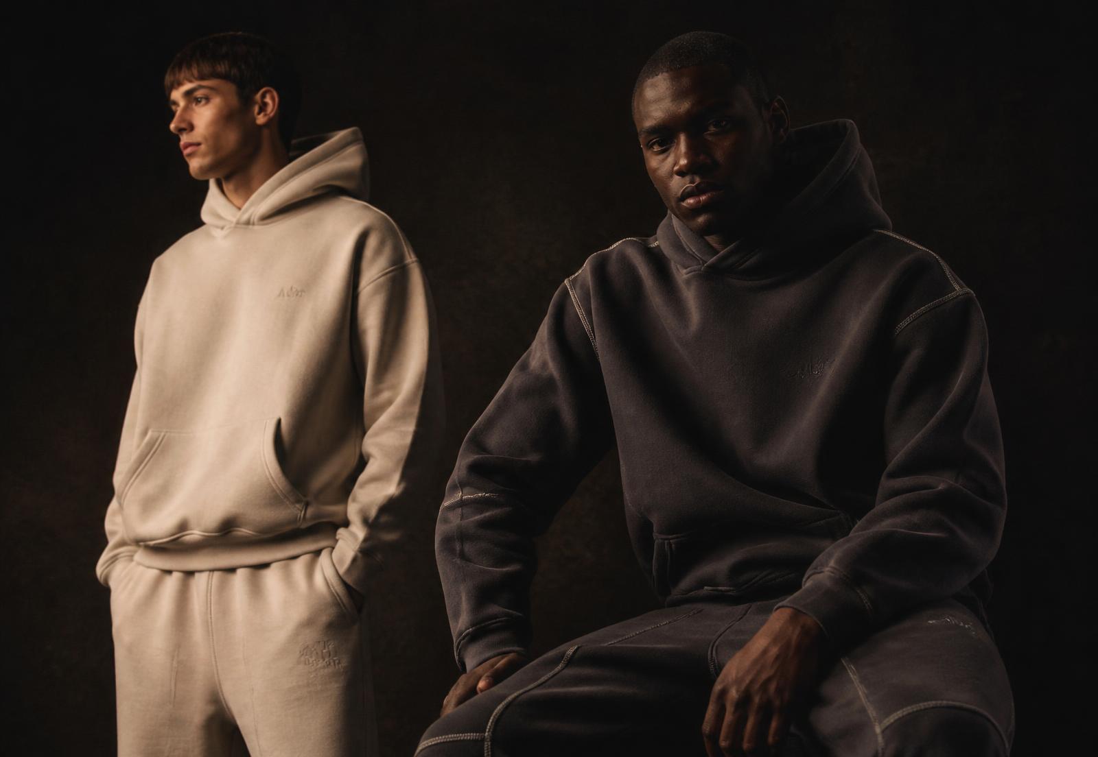 Two models wearing Velo Lux heavyweight hoodies and sweatpants